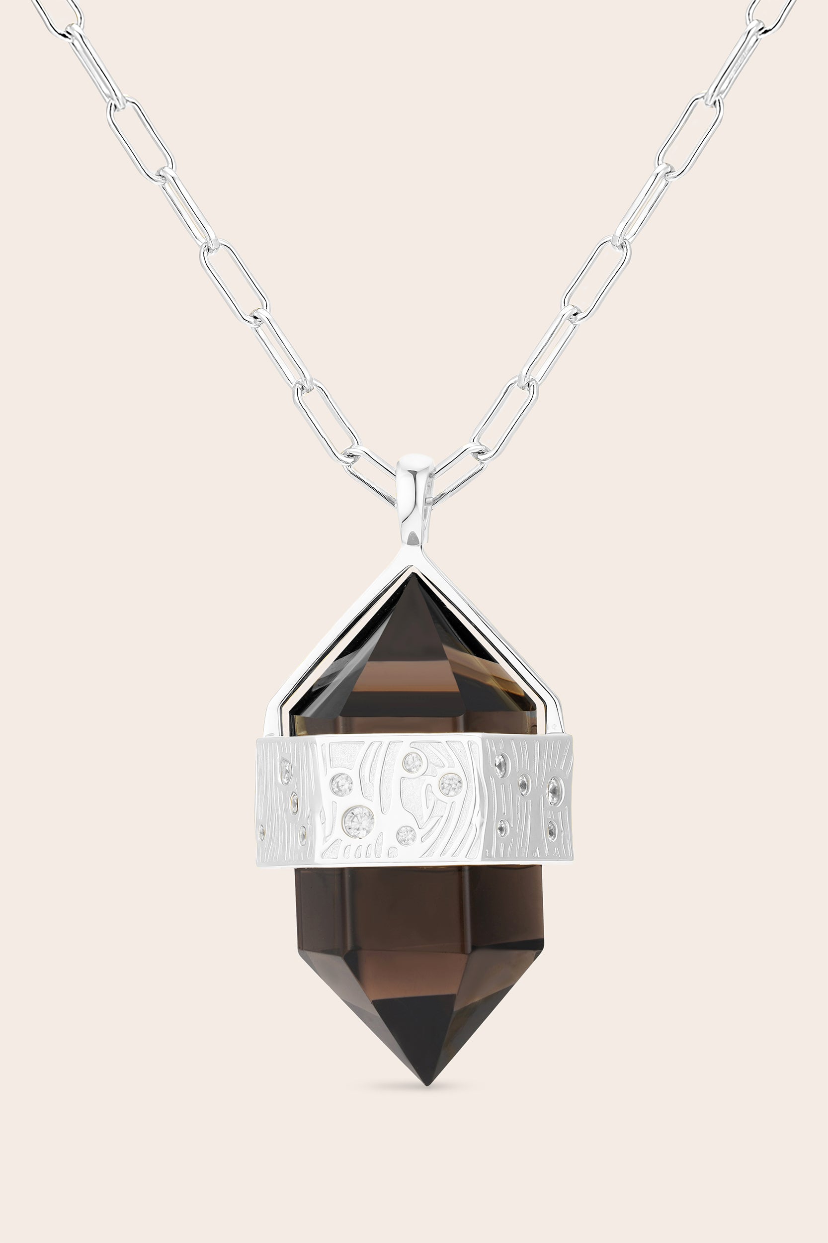 Necklace with a smoky crystal pendant on a beige background