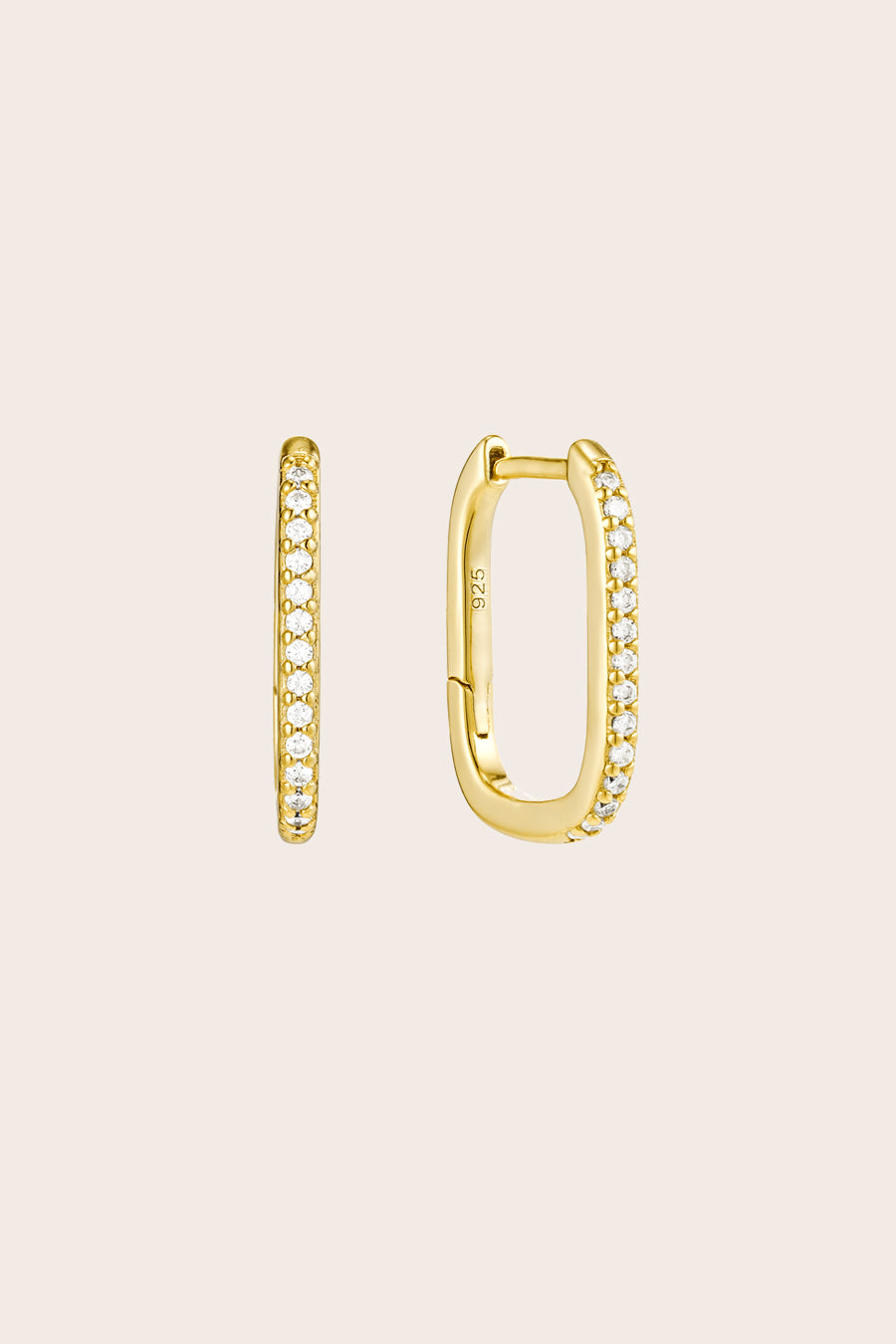 Gold Sleeper Hoop Earrings on cream background