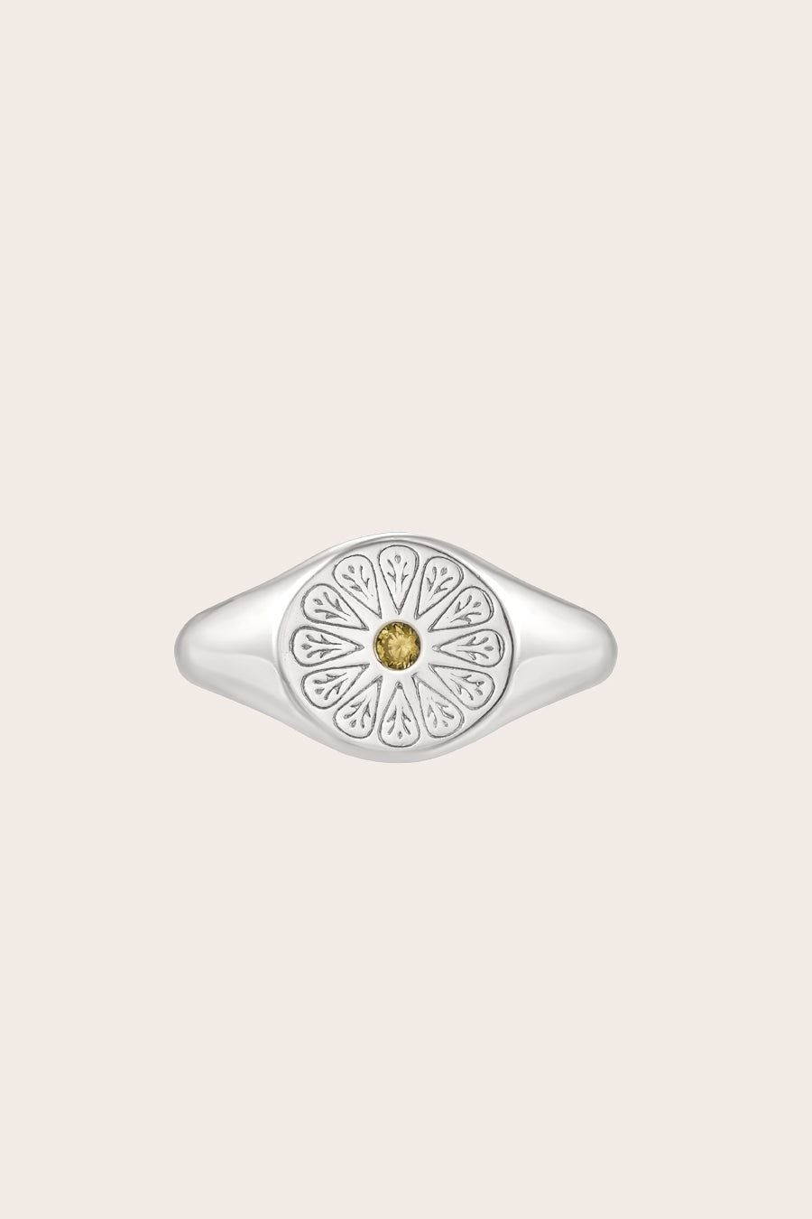Silver August Peridot Signet Birthstone Ring on cream background