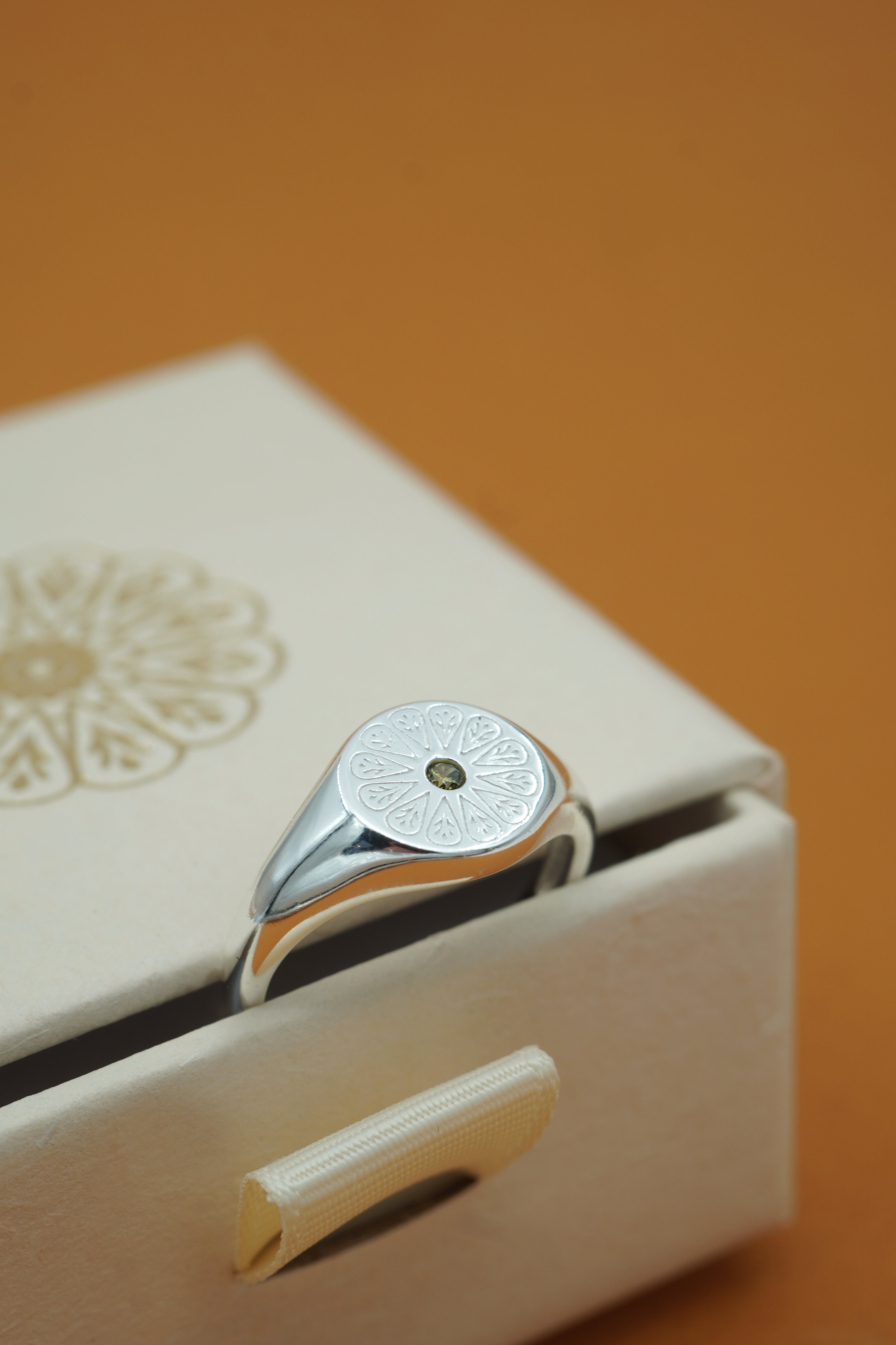 Silver August Peridot Signet Birthstone Ring on ring box
