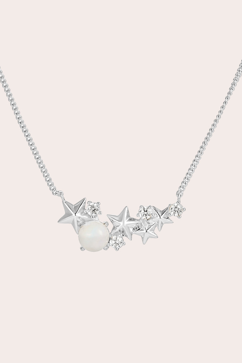 Silver Matariki Necklace on cream background