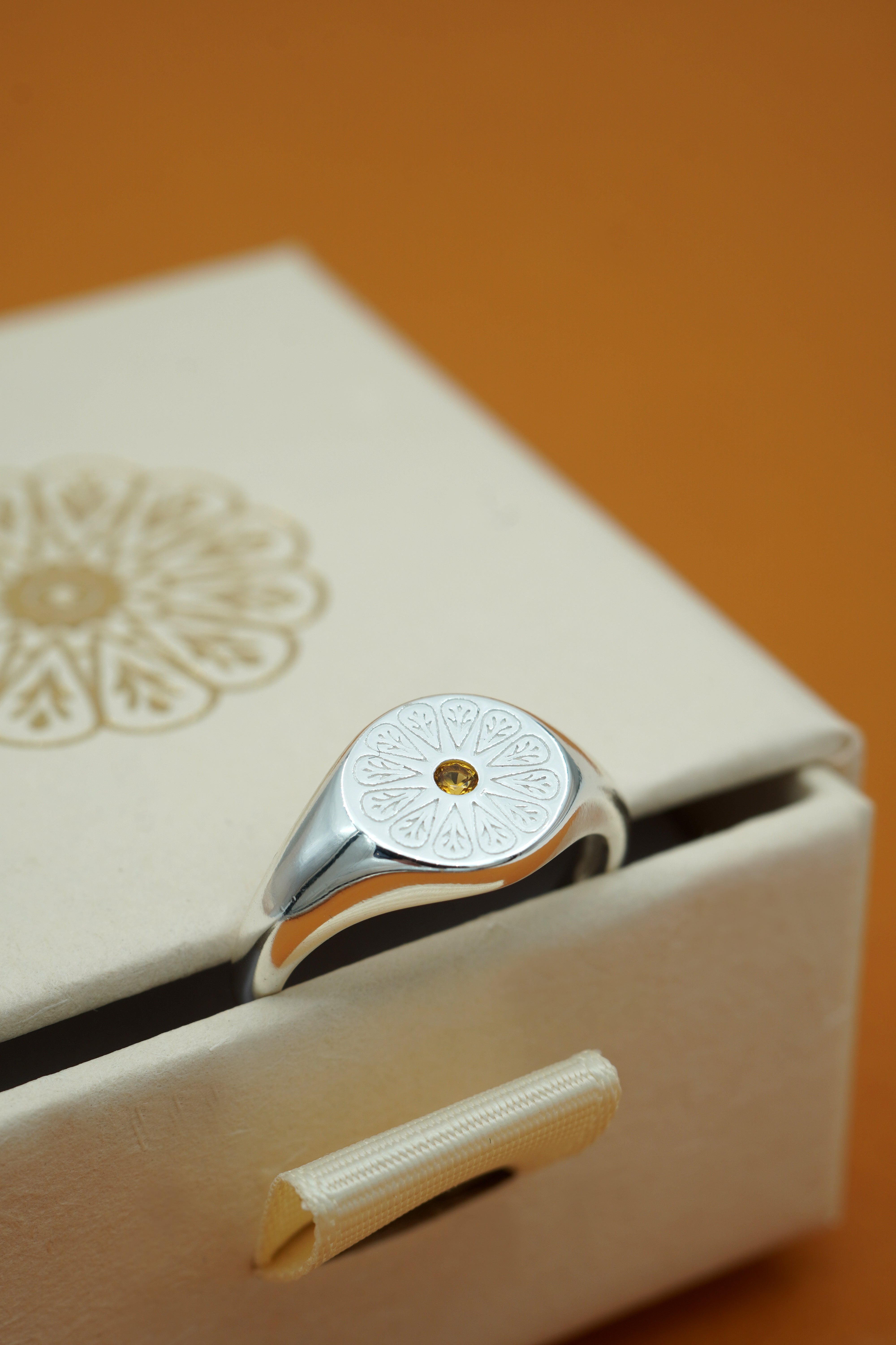 Silver Citrine November Signet Birthstone Ring on cream box
