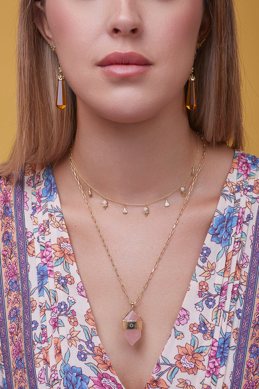 Rose Quartz Pendant Necklace layered on model