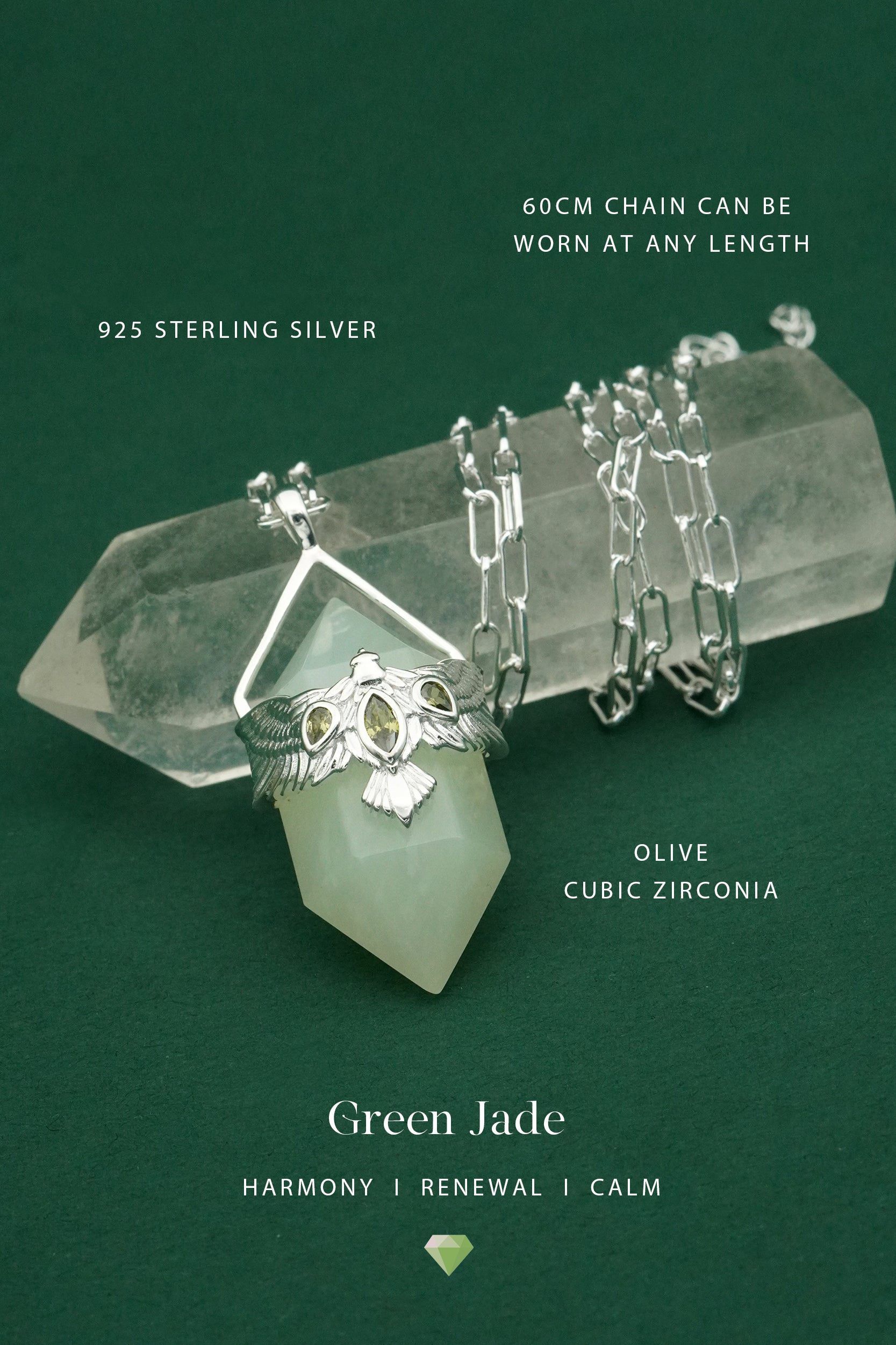 Silver jewelry with olive cubic zirconia on a green jade stone against a green background