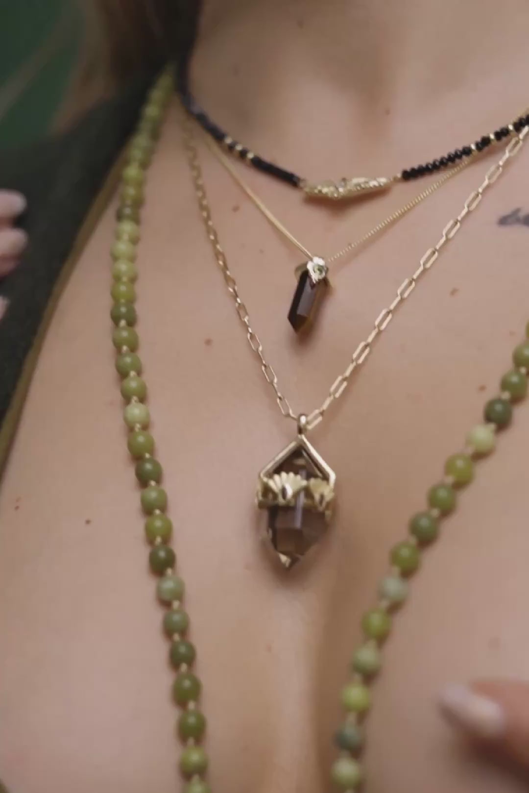 Layered gold necklaces worn on a girl