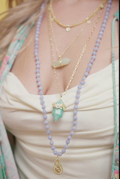 model wearing crystal gemstone jewellery