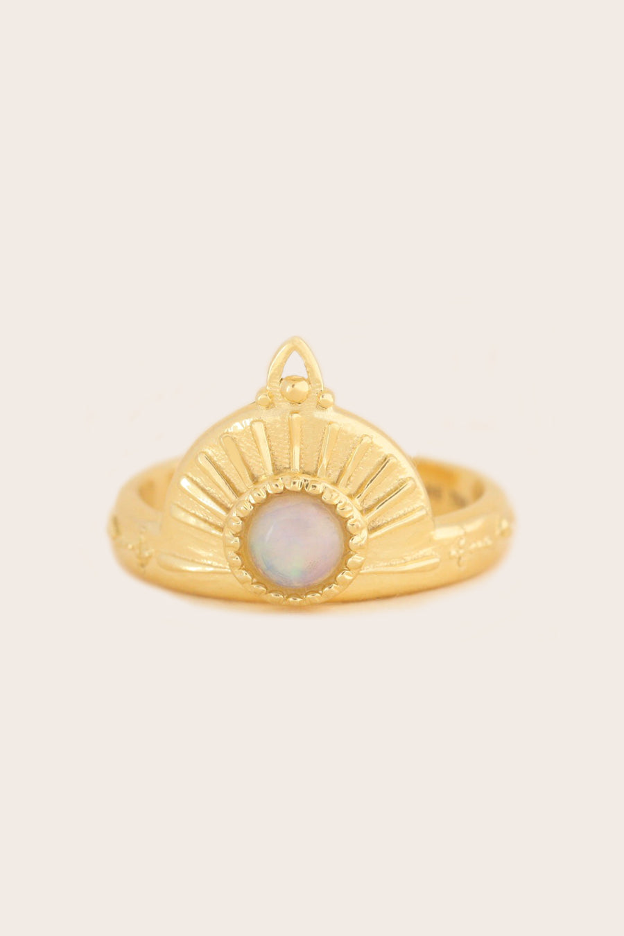 Opal Ring in gold on cream background