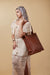 Brown Leather Tote Bag on cream background