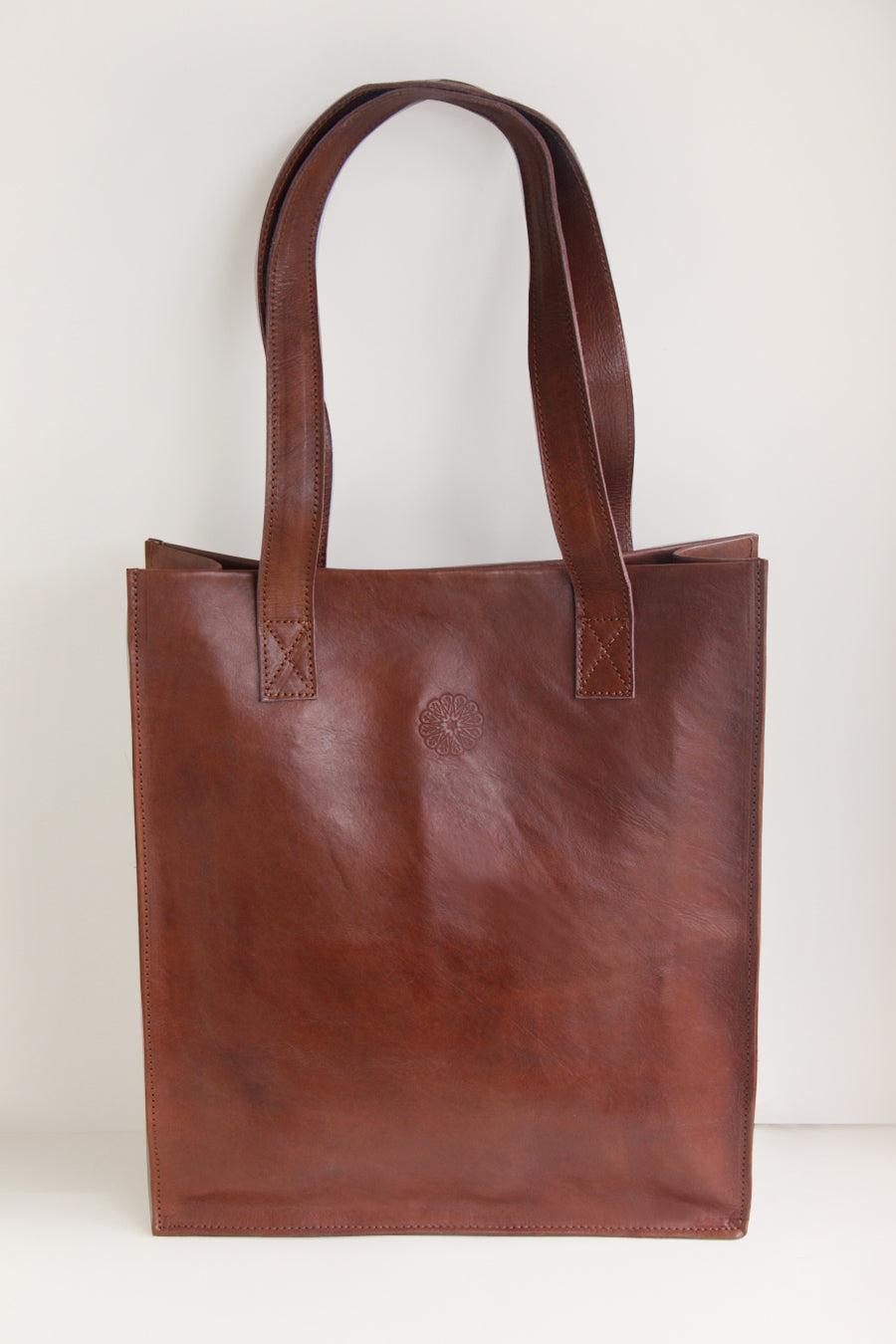 Brown Leather Tote Bag on cream background