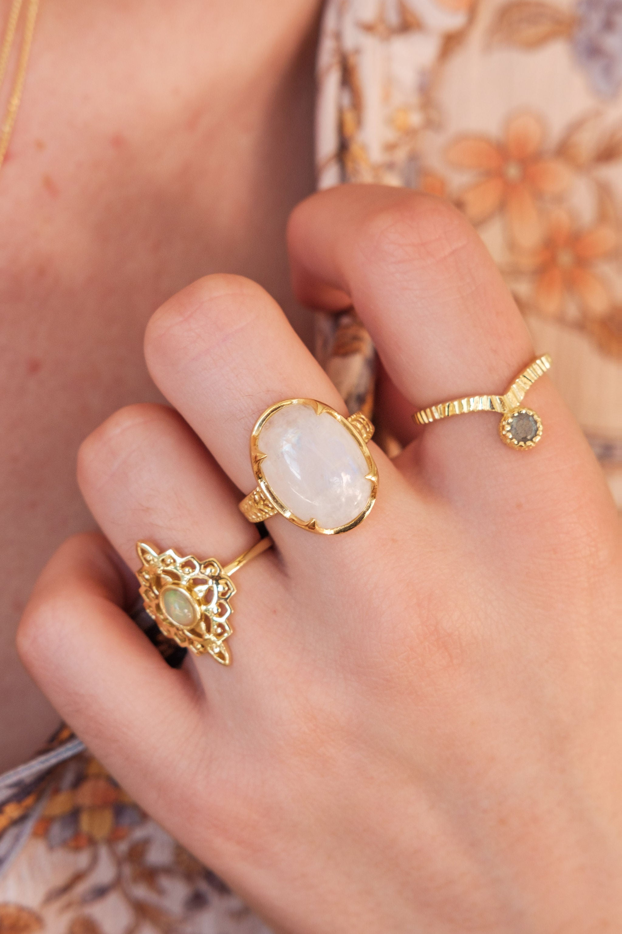 moon ring and filigree rings being worn on hand