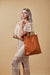 Tan Leather Tote Bag on Cream Background