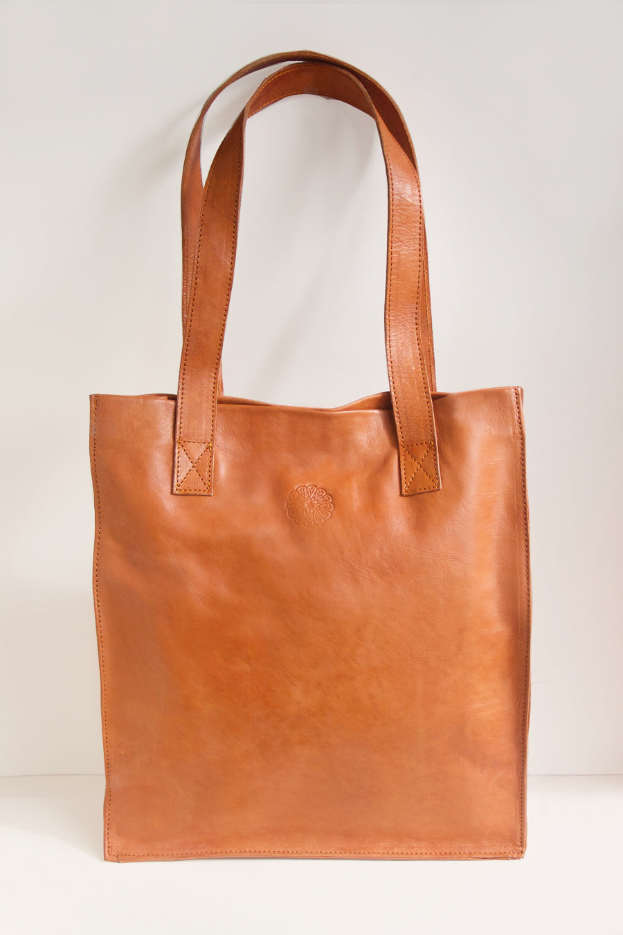 Tan Leather Tote Bag on Cream Background