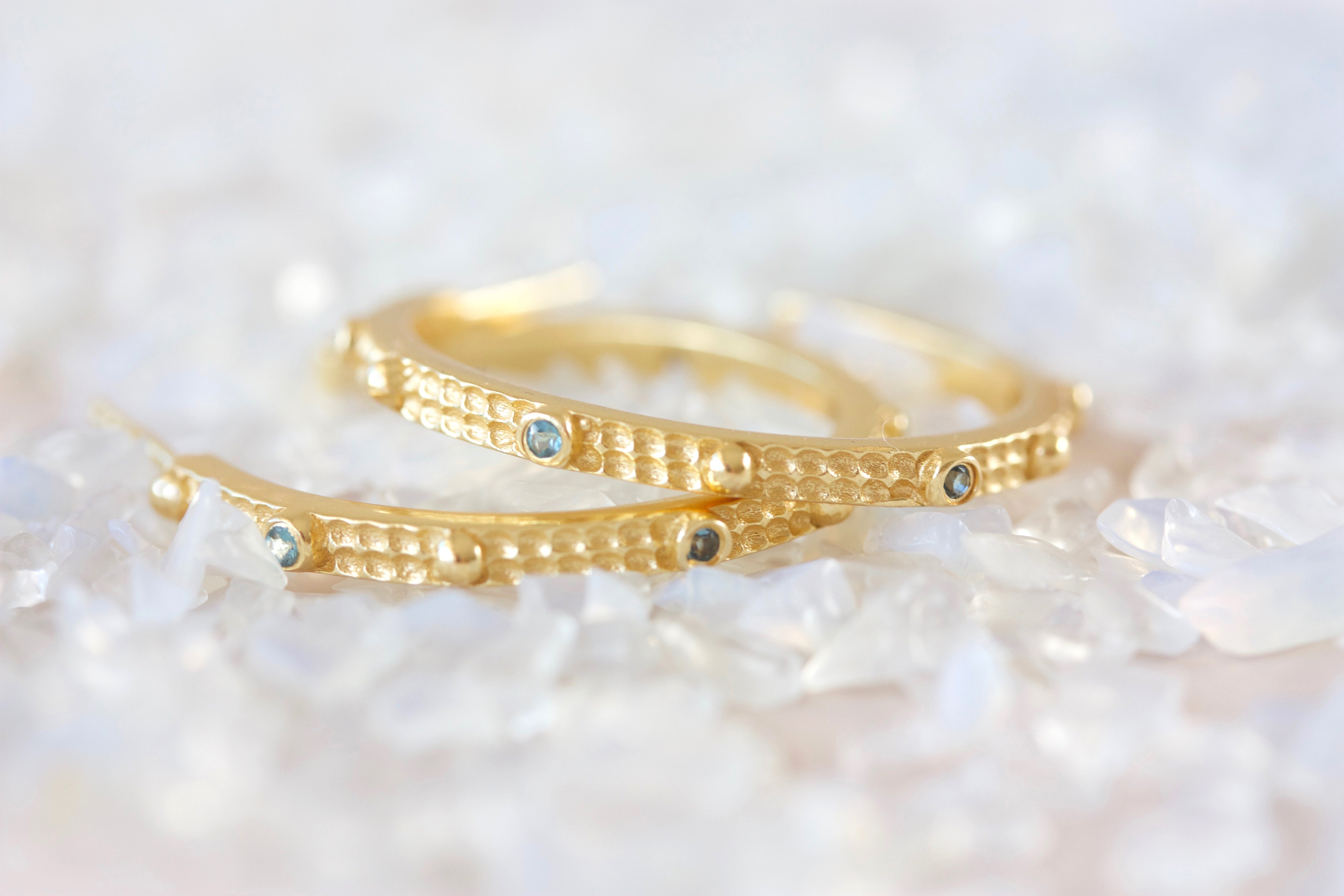 gold large hoop earrings with blue crystals